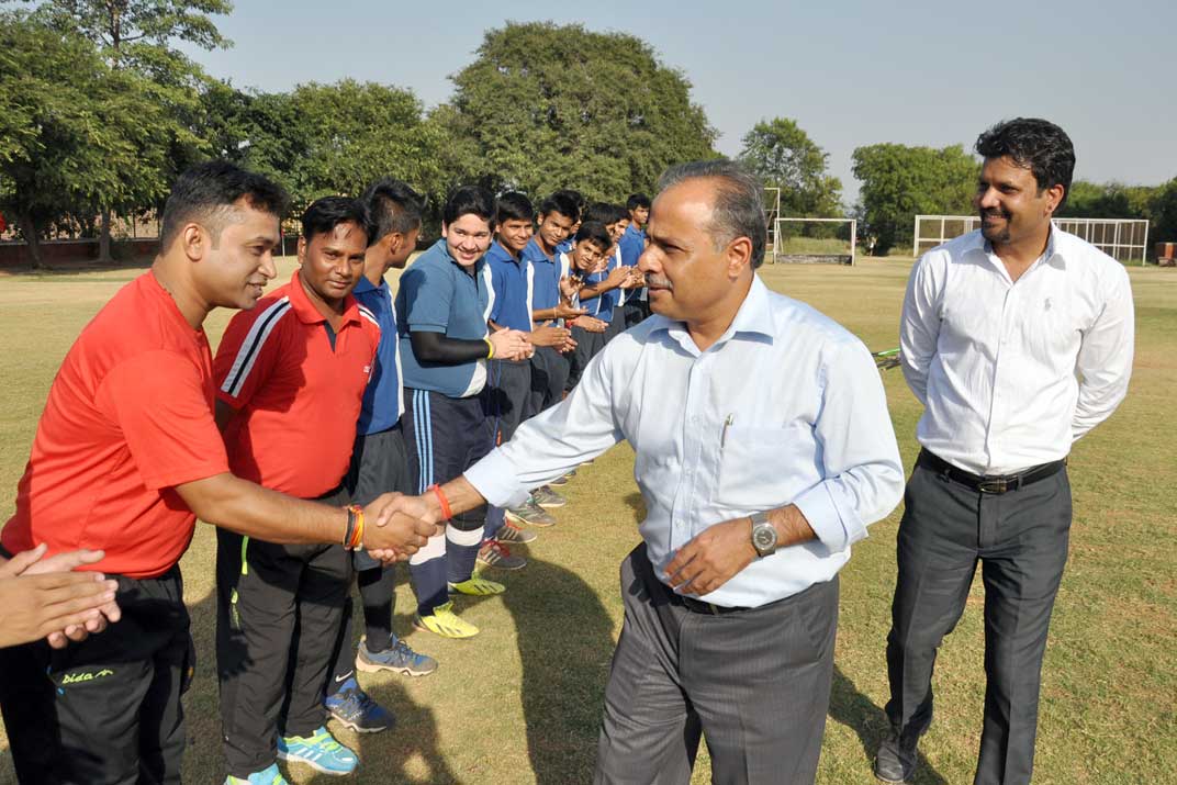 Principal greeting the finalists and the match officials